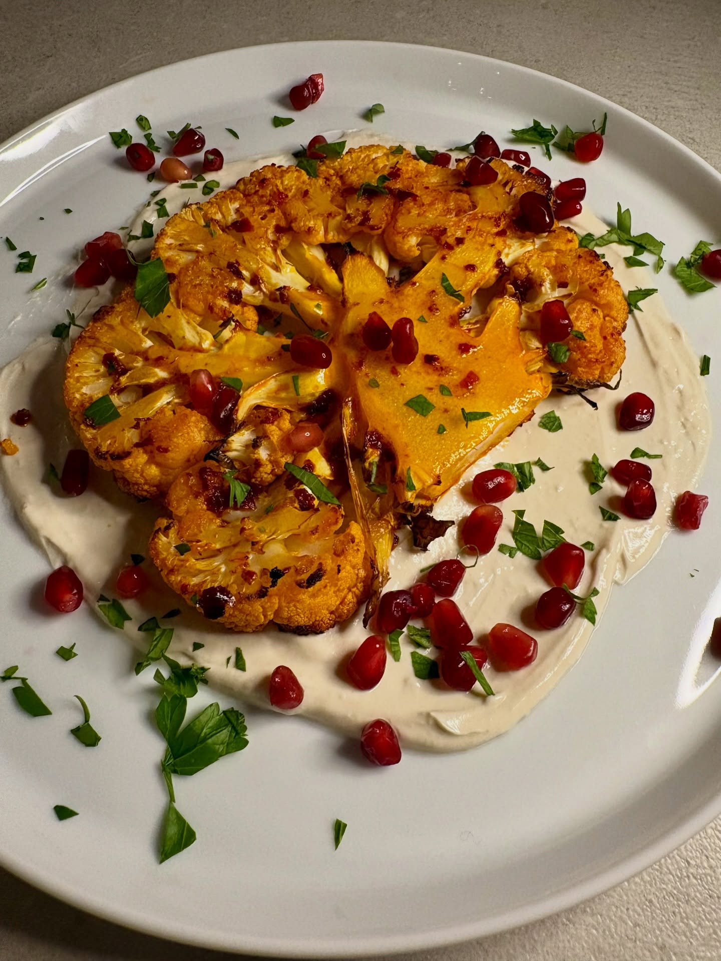 Not what my husband was expecting when I told him it was steak night, but he took it well! Roasted cauliflower steaks that had been marinated in a rose harissa paste mix (not quite sure what else I added!). Served on a tahini sauce of tahini, Greek yoghurt, lemon juice and garlic. Topped with pomegranate seeds and chopped flat leaf parsley. Yum!
Harissa paste and tahini - @belazu_co
#cauliflower #cauliflowerrecipes #eatwell