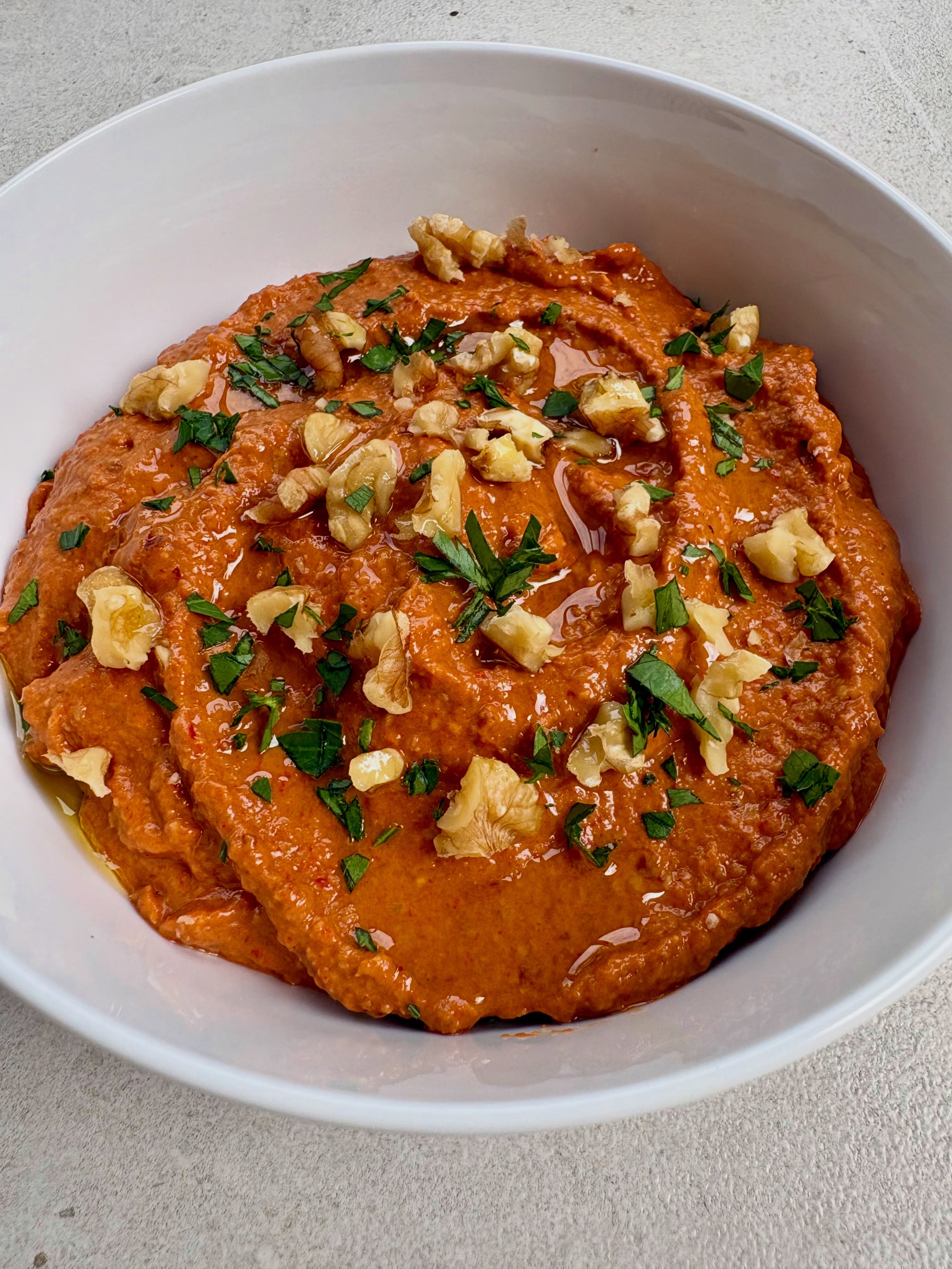 I don’t know why it’s taken me so long to make Muhammara again, as it’s such a delicious Middle Eastern dip. Blackened peppers are blended with walnuts, breadcrumbs, pomegranate molasses, lemon juice, cumin, garlic and Aleppo pepper flakes. I like to add a tablespoon of honey to mine to balance out the tartness, but either way it’s gorgeous with some flatbreads and makes a great alternative to hummus.
See the recipe - https://www.georgesbristolkitchen.co.uk/muhammara---middle-eastern-pepper-and-walnut-dip
#muhammara #dips #middleeasternfood